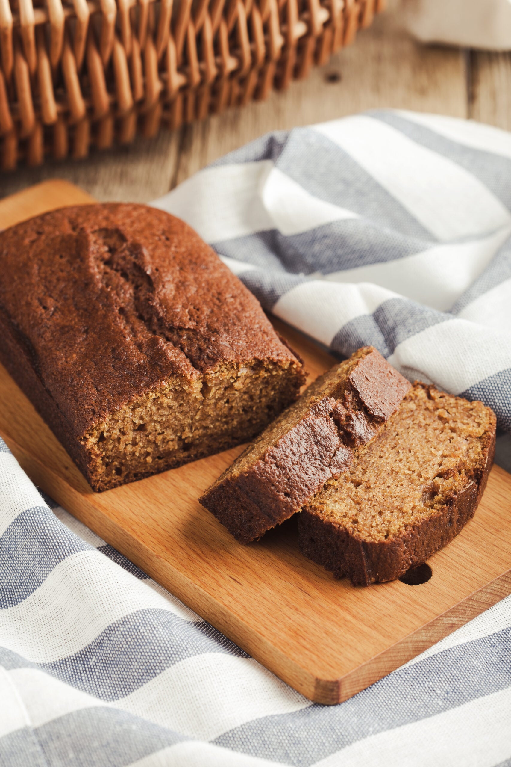 Sliced pumpkin bread made with fresh pumpkin puree on a rustic wooden board