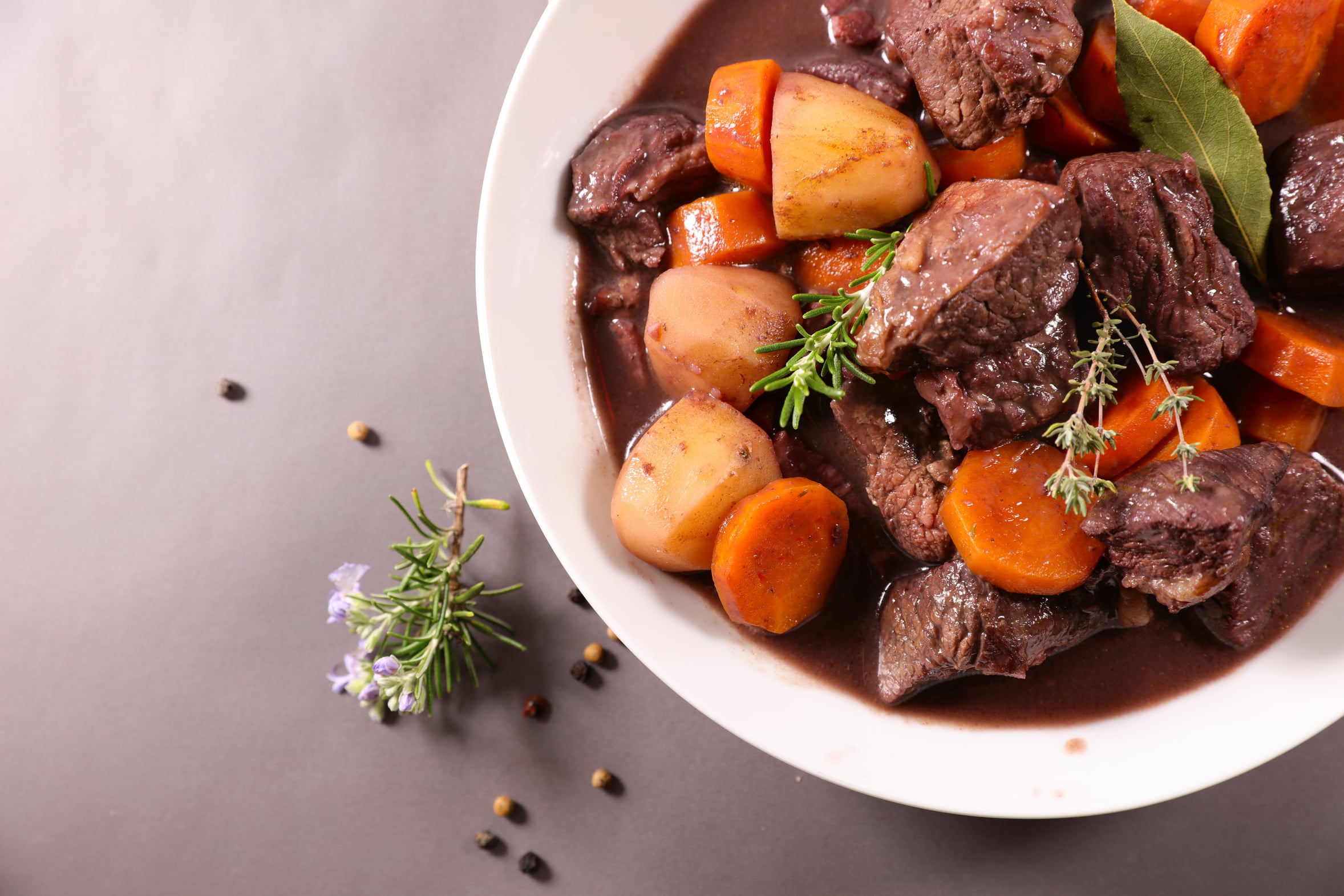 Slow cooker beef stew from scratch with carrots and potatoes in a dark gravy