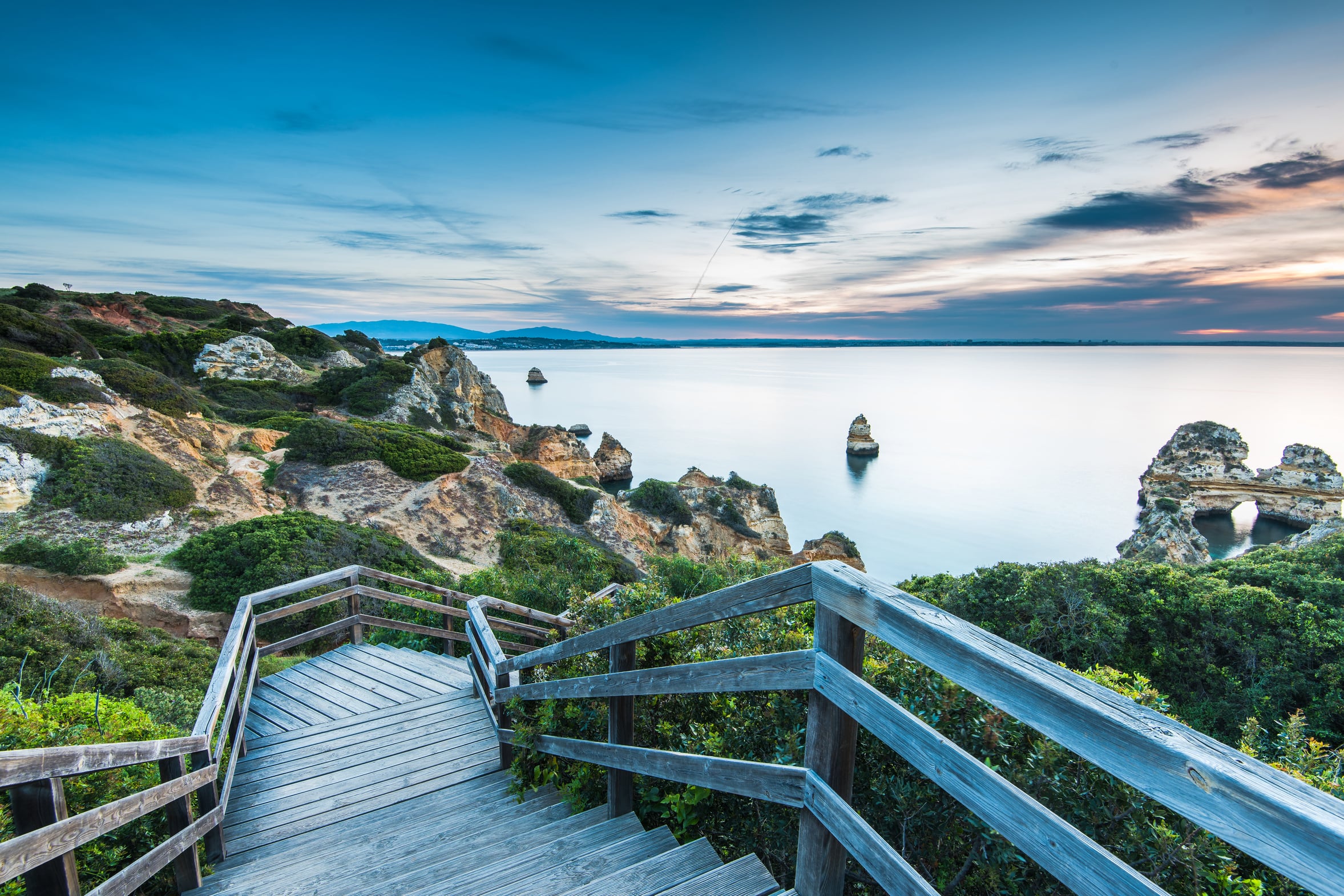 The wooden staircase and walkway down the cliff to Praia do Camilo in Lagos, Portugal