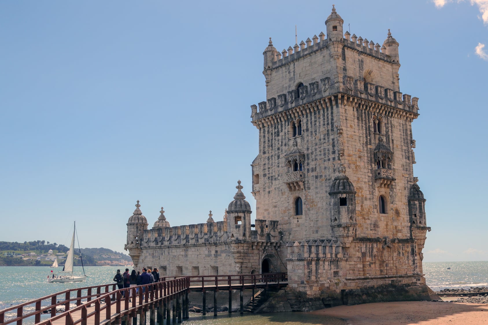 Belem Tower on the flat riverside path in Belem, Lisbon