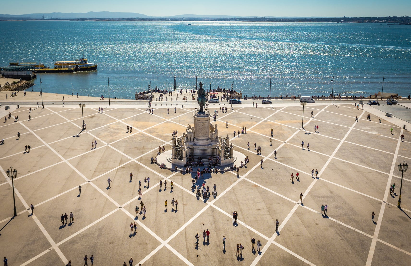 Praca do Comercio in the flat Baixa district of Lisbon, seen through the Rua Augusta arch