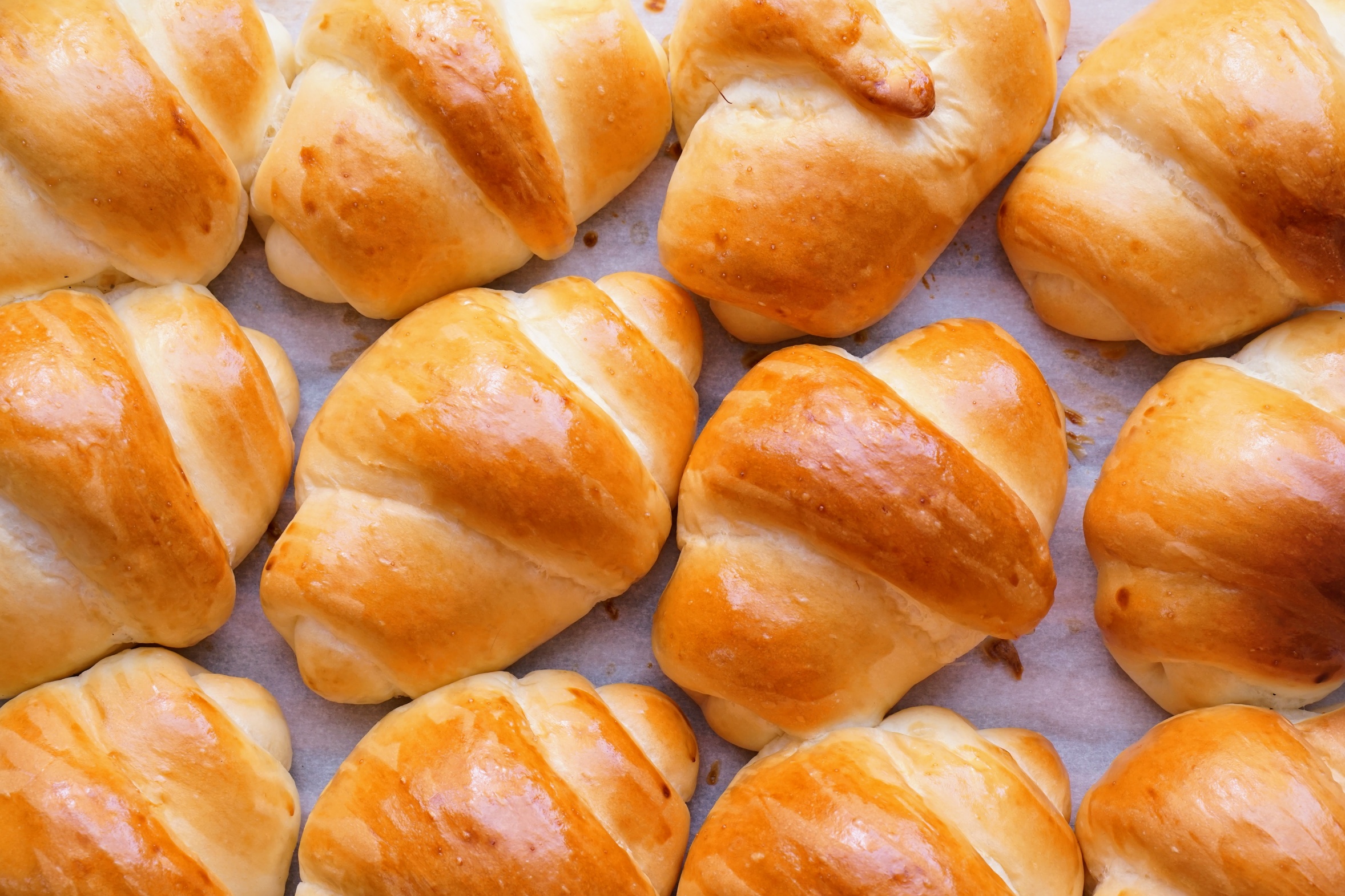 A pan of golden homemade make-ahead dinner rolls fresh from the oven