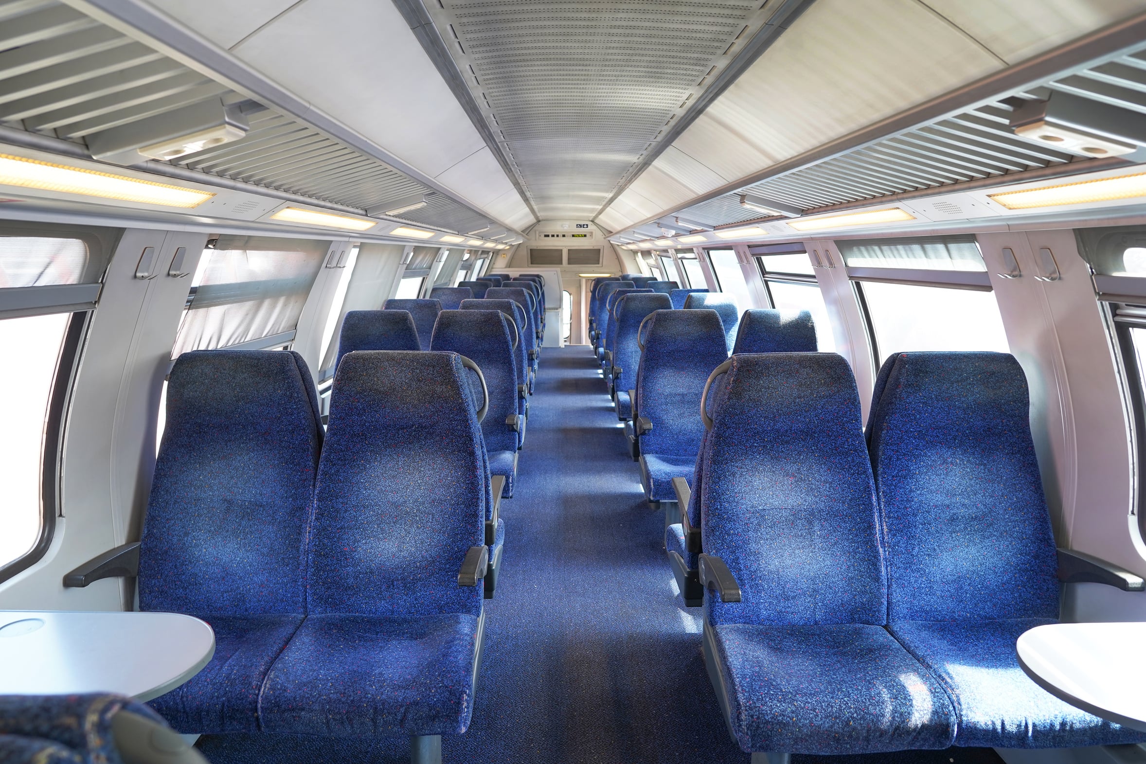 Empty seats inside a modern passenger train carriage of the kind used on routes across Portugal