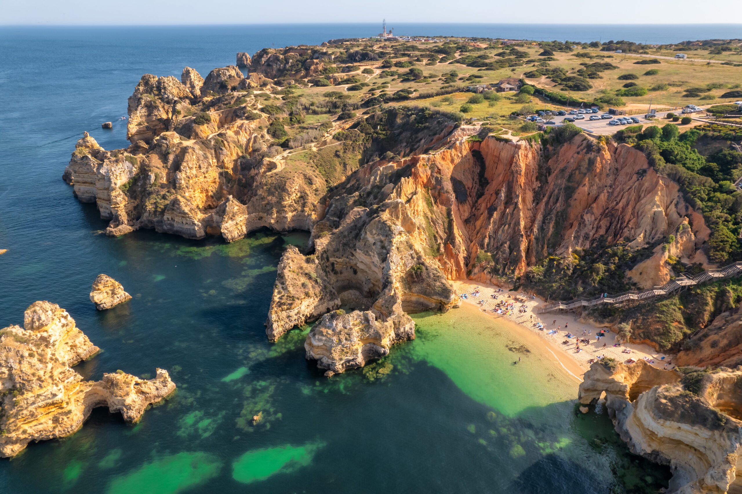 Praia do Camilo, a sheltered cove beach with golden cliffs near Lagos in the Algarve, Portugal